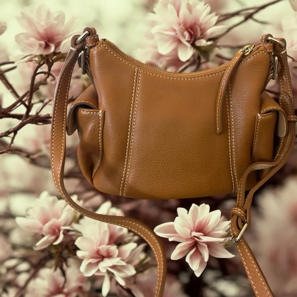 Dooney & Bourke Pebbled Grain Pocket Sac Crossbody with Side Pockets.